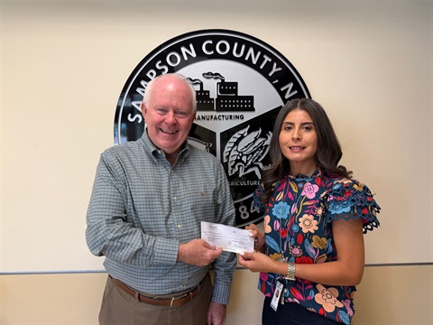 ABC Board Presents Check to DSS Director.jpg
